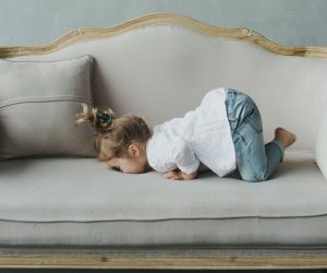 Natural alternative to Miralax, child in "poop position", a position that helps move your bowels.